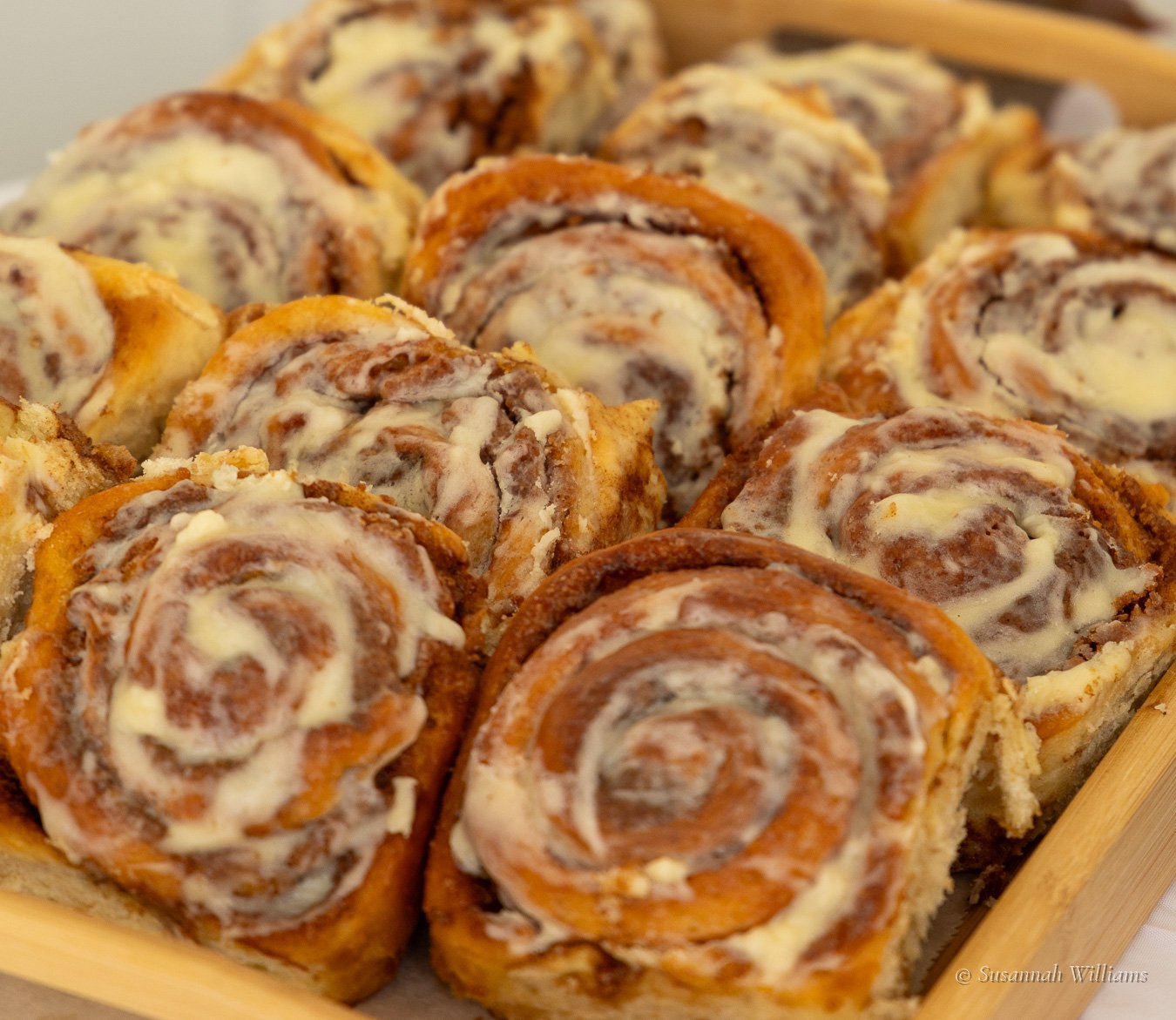 A tray of iced cinnamon rolls.